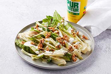Grilled Romaine lettuce with a lactose-free dressing